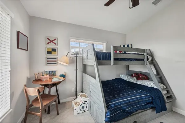 a bedroom with furniture and a chandelier