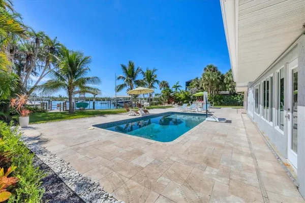 a view of a swimming pool with a patio