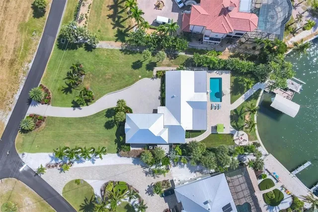 an aerial view of a house with outdoor space