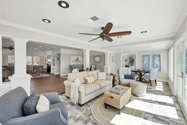 a view of a dining room with furniture and wooden floor