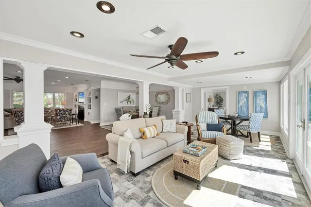 a view of a dining room with furniture and wooden floor