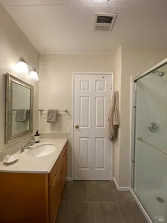 a bathroom with a sink and mirror
