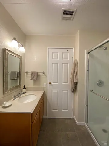 a bathroom with a sink and mirror