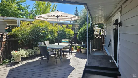 a view of a patio with furniture and yard