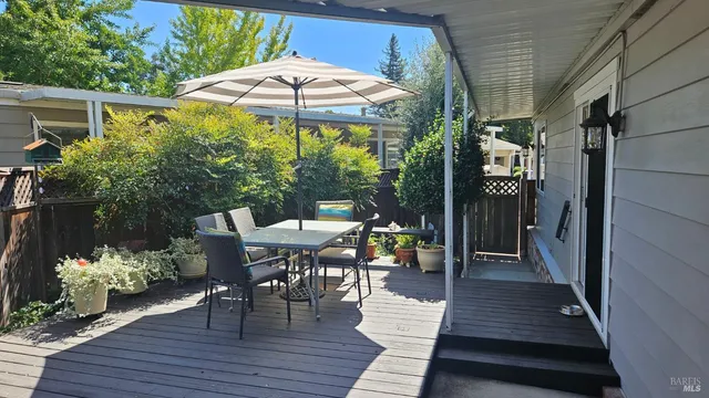 a view of a patio with furniture and yard