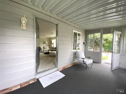 a view of a hallway with wooden door