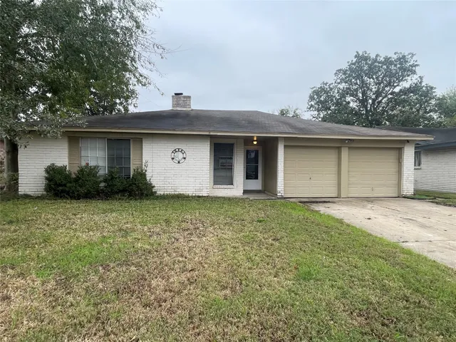 a house with trees in the background