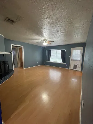 a view of livingroom and hardwood floor