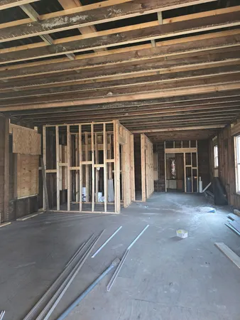 a view of an empty room with a fireplace