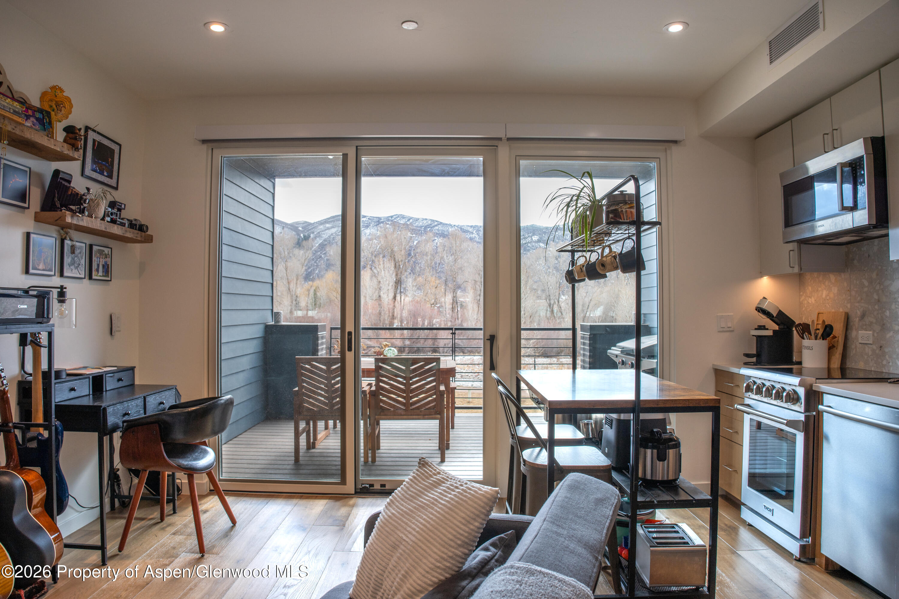 22860 2 Rivers Road, Unit 274 Basalt, CO 81621 - Photo 6 of 13 a living room with furniture and a floor to ceiling window