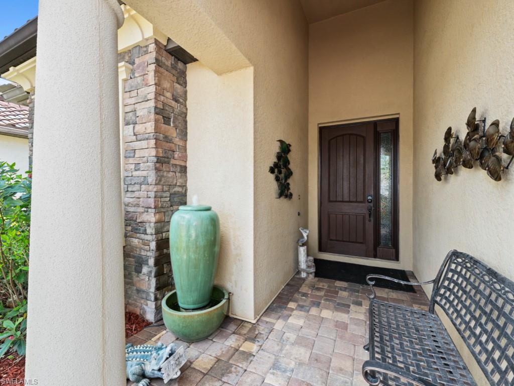 9522 Piacere Way Naples, FL 34113 - Photo 4 of 48 Entrance to property featuring stucco siding