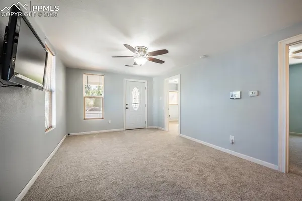 a view of an empty room with a window