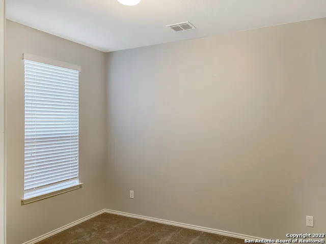 a view of a room that has a window in it