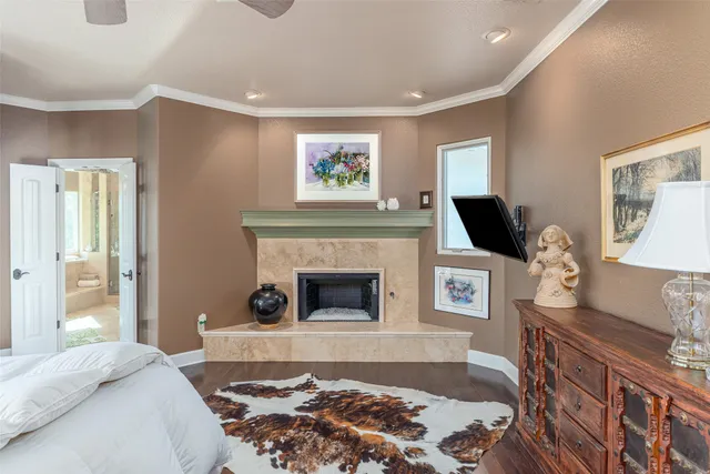 a view of a backyard with chairs potted plants