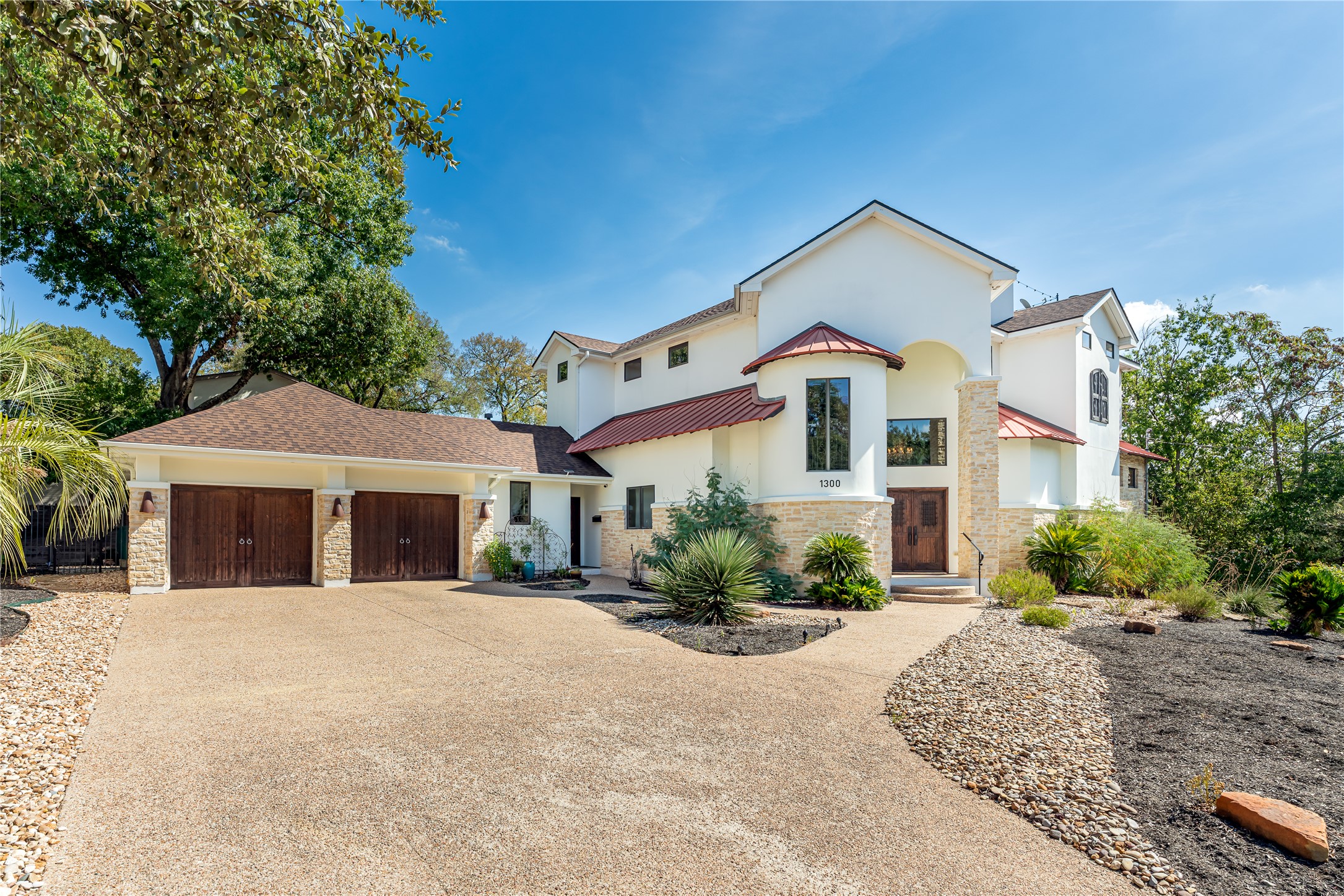 1300 Bluff Street Austin, TX 78704 - Photo 6 of 40 a front view of a house with a yard and potted plants