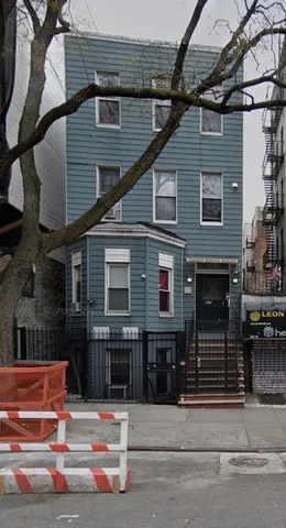 a view of a house with a street