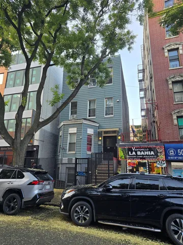 a car parked in front of a house