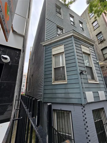 a view of a house with a door and wooden floor