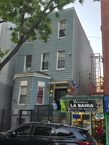 a front view of a house with parking