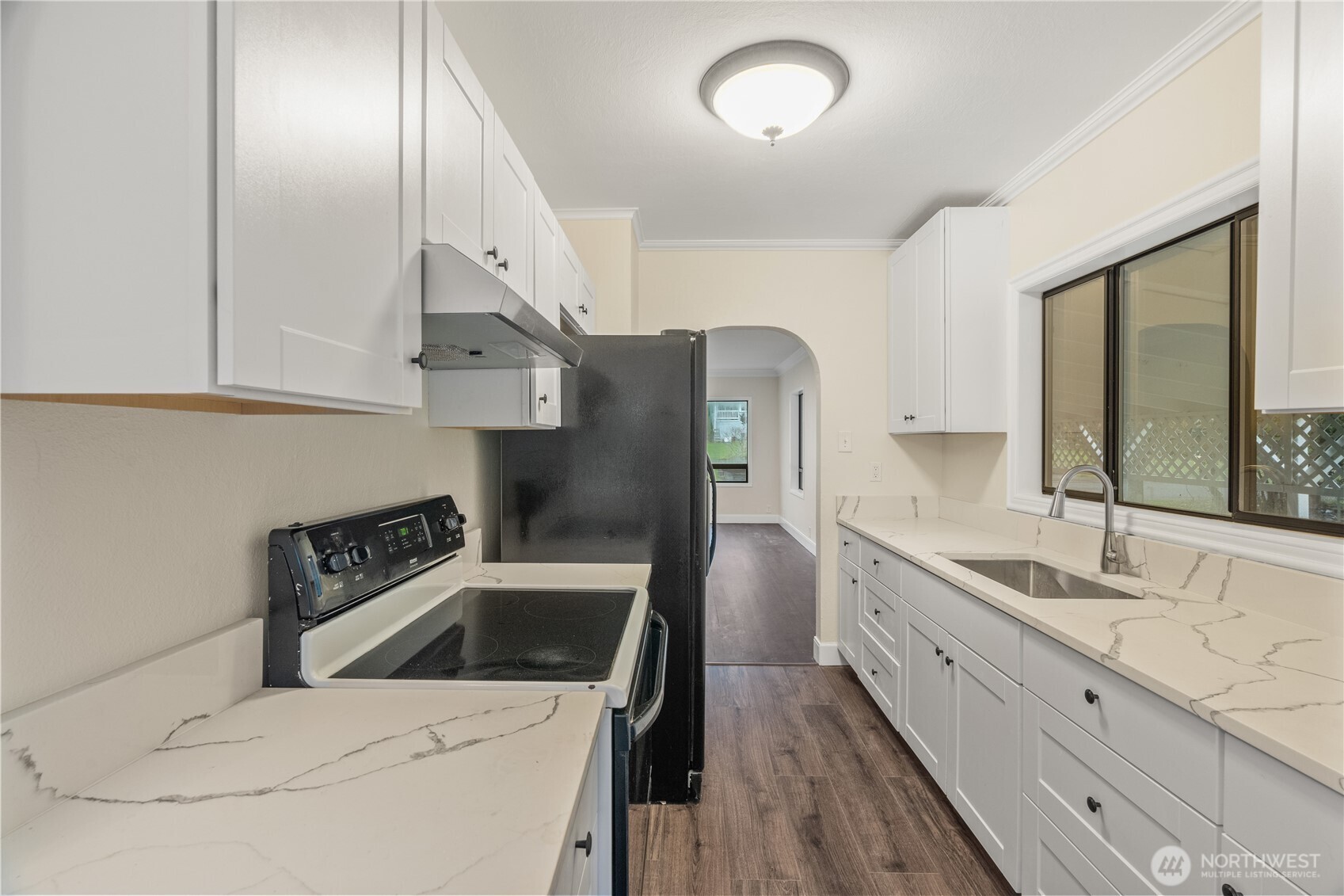 330 Wheeler Avenue Hoquiam, WA 98550 - Photo 17 of 34 a kitchen with a sink and a refrigerator