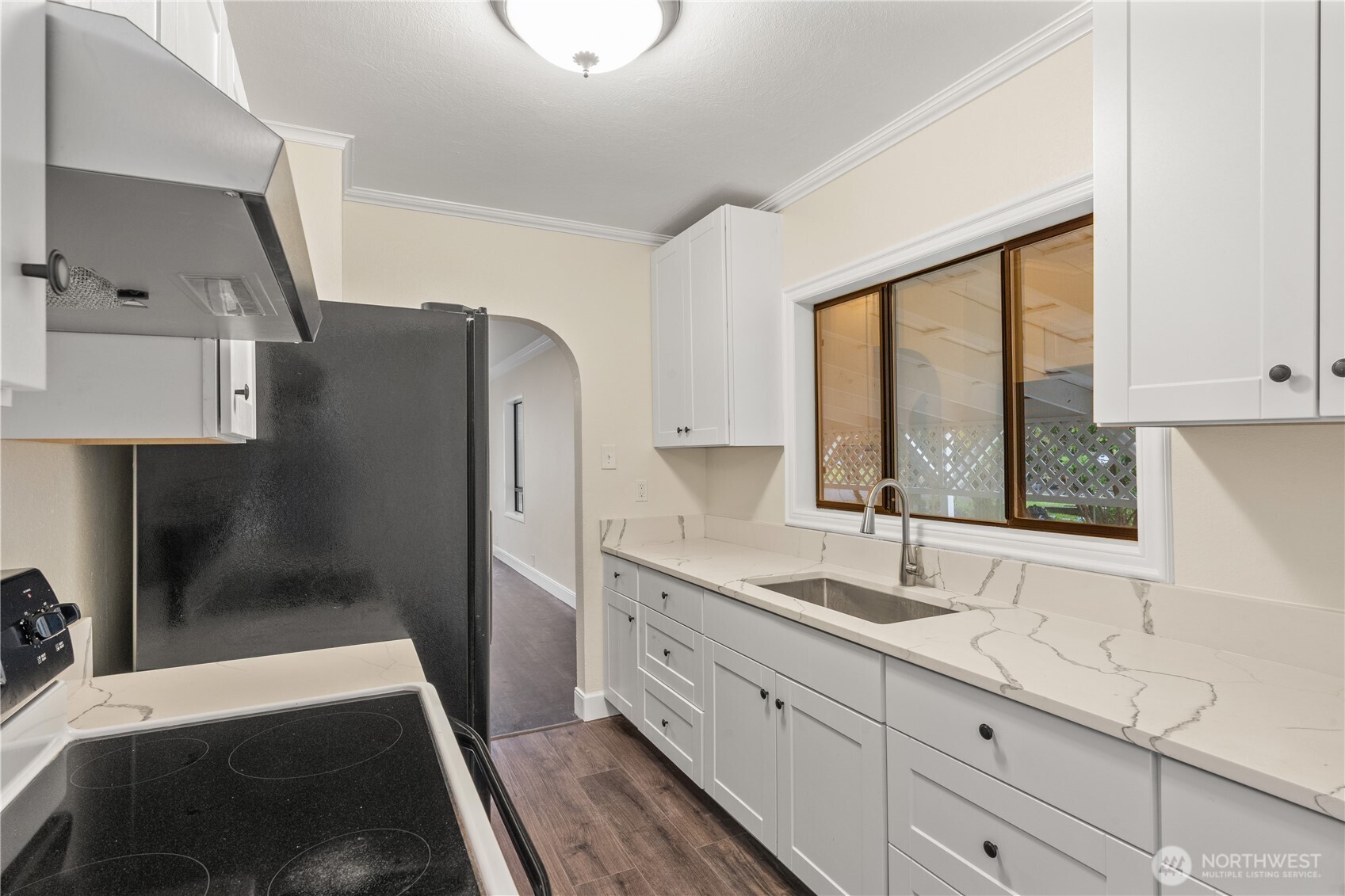 330 Wheeler Avenue Hoquiam, WA 98550 - Photo 18 of 34 a spacious bathroom with a double vanity sink a mirror and a shower