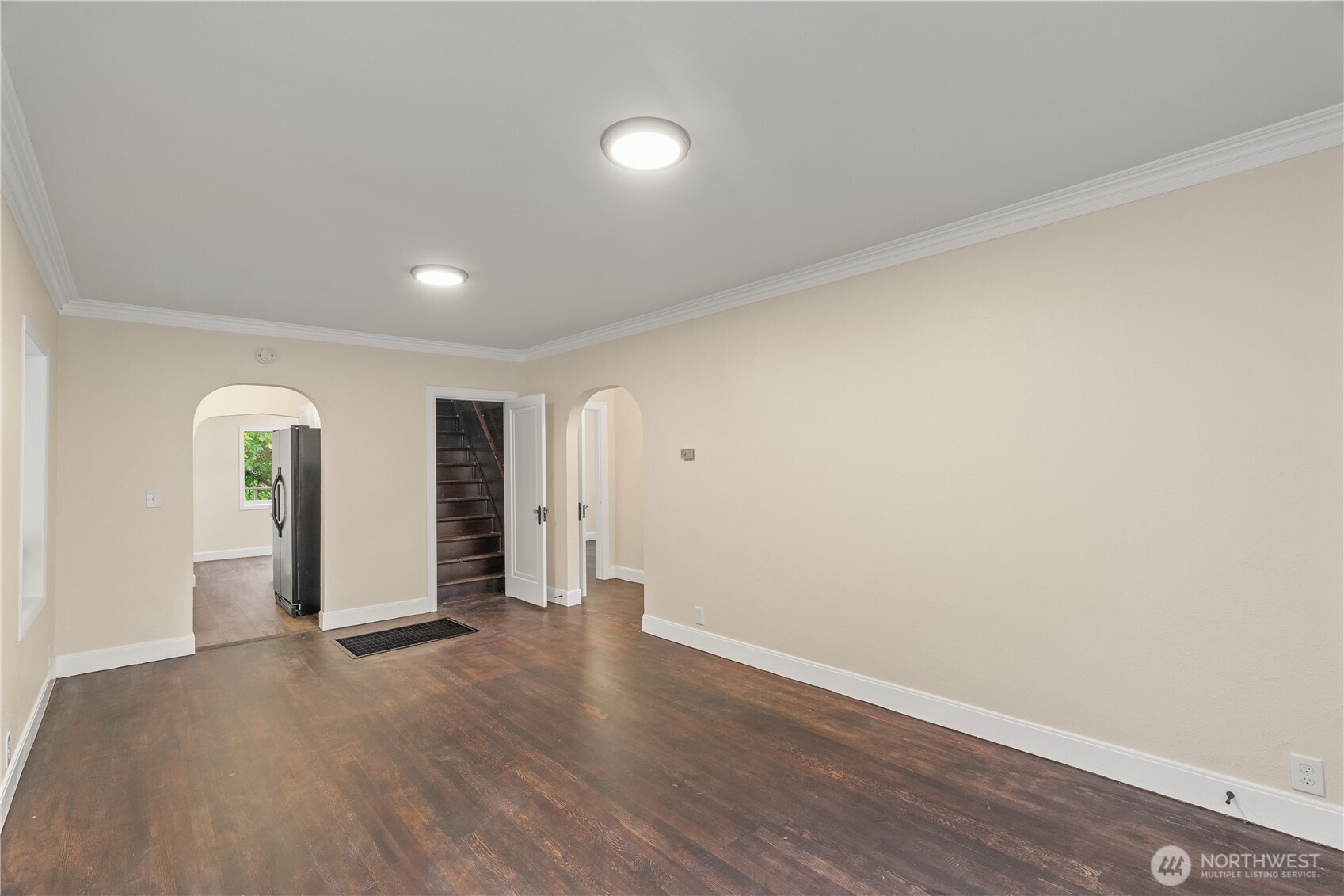 330 Wheeler Avenue Hoquiam, WA 98550 - Photo 5 of 34 an empty room with wooden floor and windows