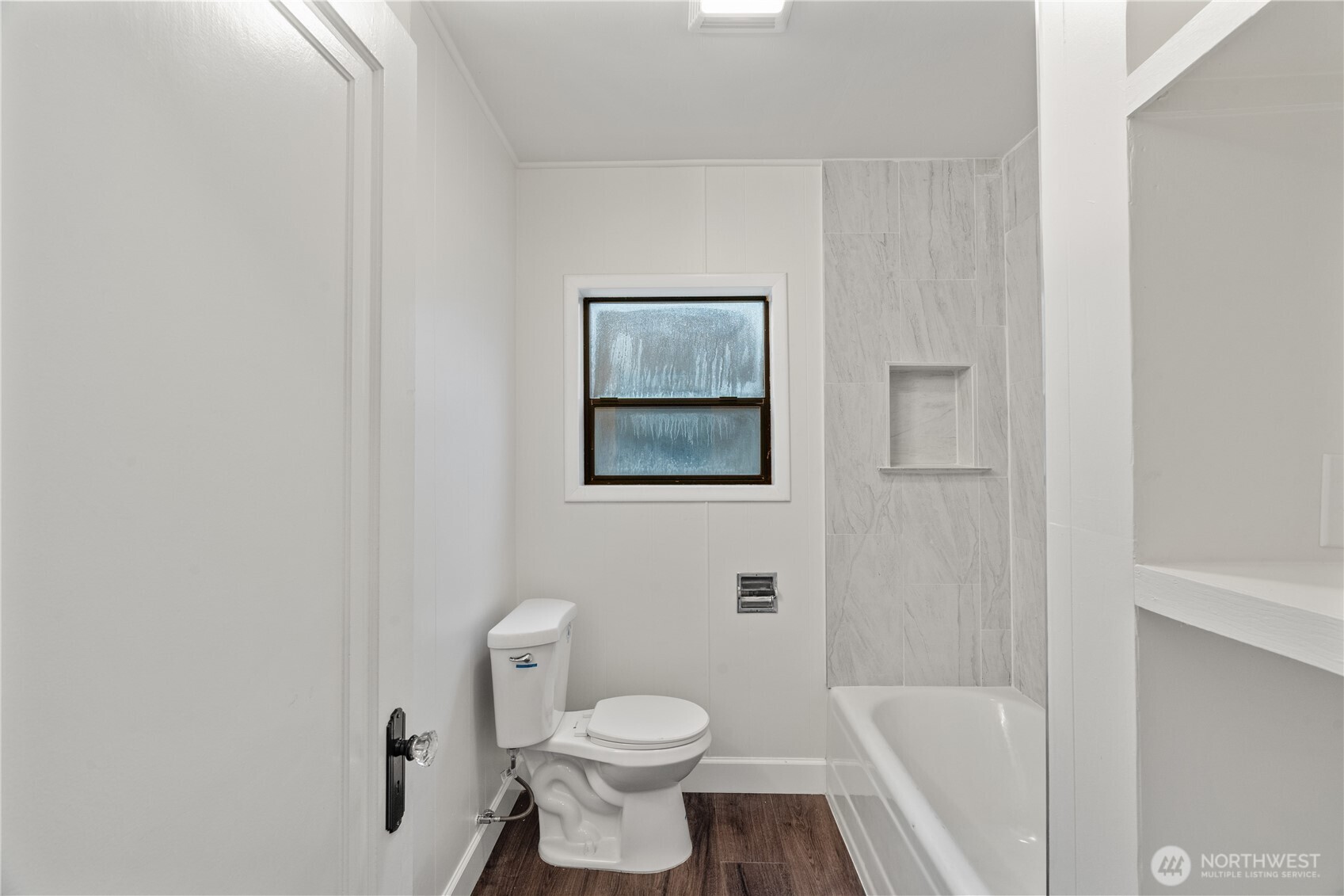 330 Wheeler Avenue Hoquiam, WA 98550 - Photo 9 of 34 a white toilet sitting next to a bath tub