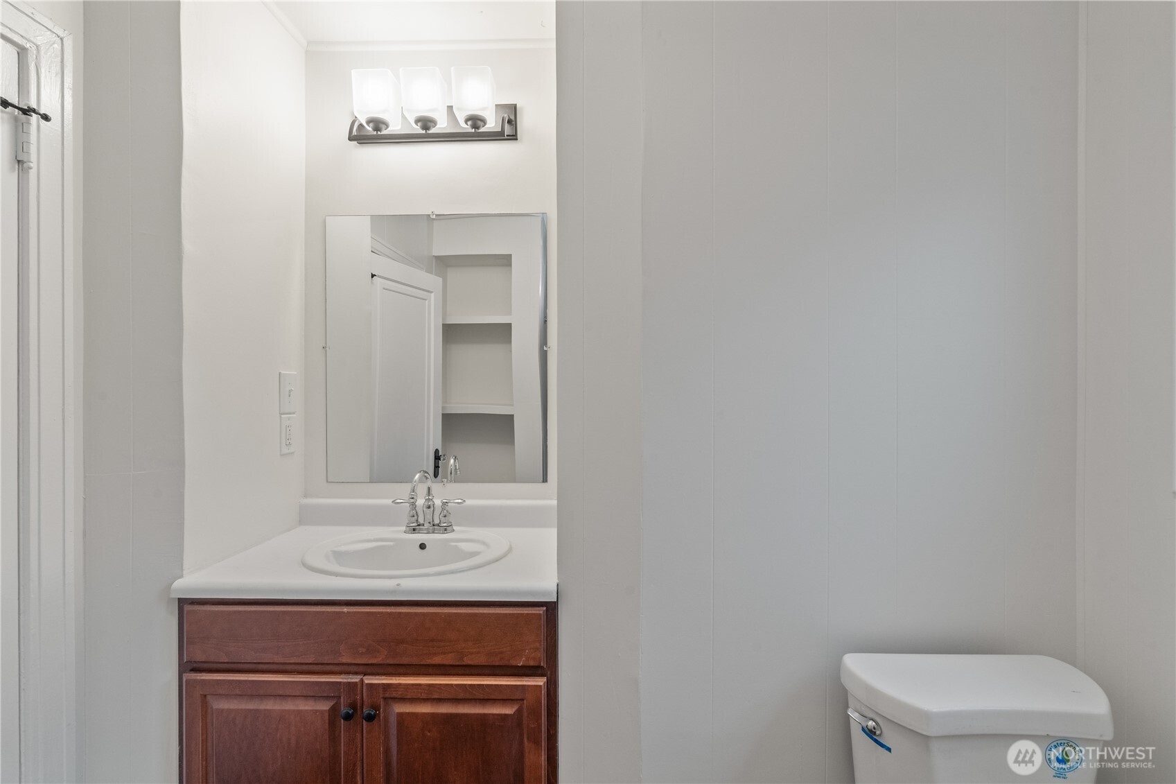 330 Wheeler Avenue Hoquiam, WA 98550 - Photo 10 of 34 a bathroom with a sink a toilet and mirror