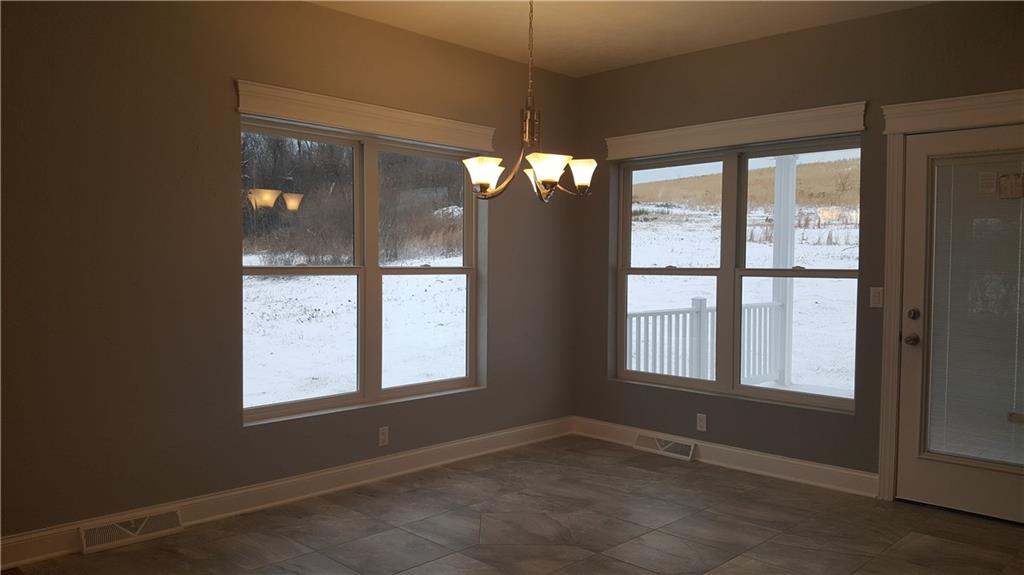 234 Pond Road Latrobe, PA 15650 - Photo 4 of 25 Dining room with ceramic tile floor, doors which lead to cover patio