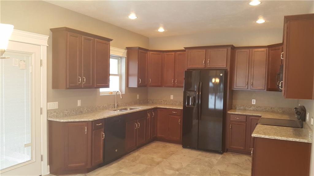 234 Pond Road Latrobe, PA 15650 - Photo 5 of 25 Kitchen with ceramic tile floors, all appliances, granite tops , recess lights and doors which lead to a covered rear patio
