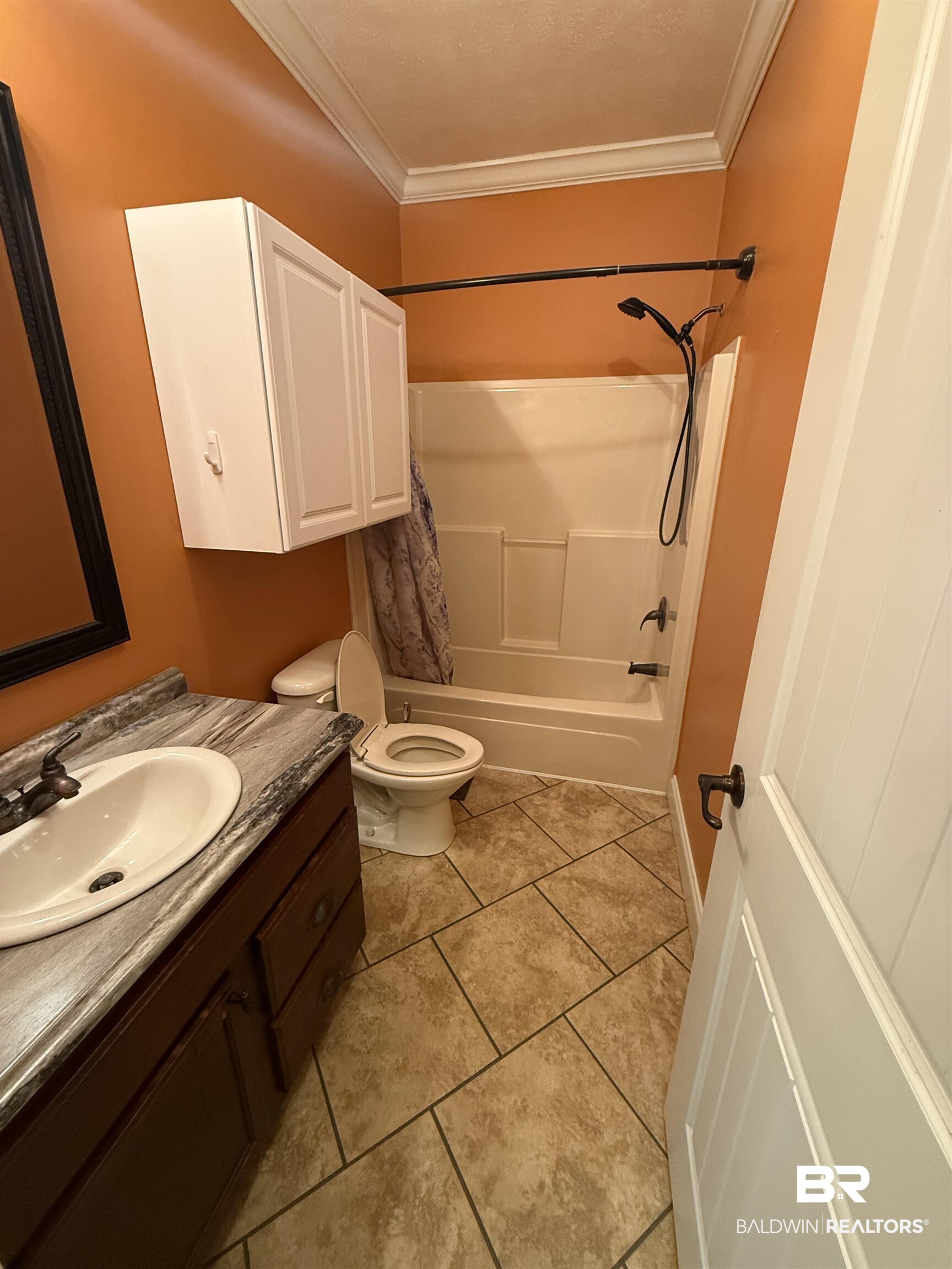 1274 Caney Loop Lillian, AL 36549 - Photo 17 of 19 Bathroom with vanity, shower / bath combo, ornamental molding, and light tile patterned floors