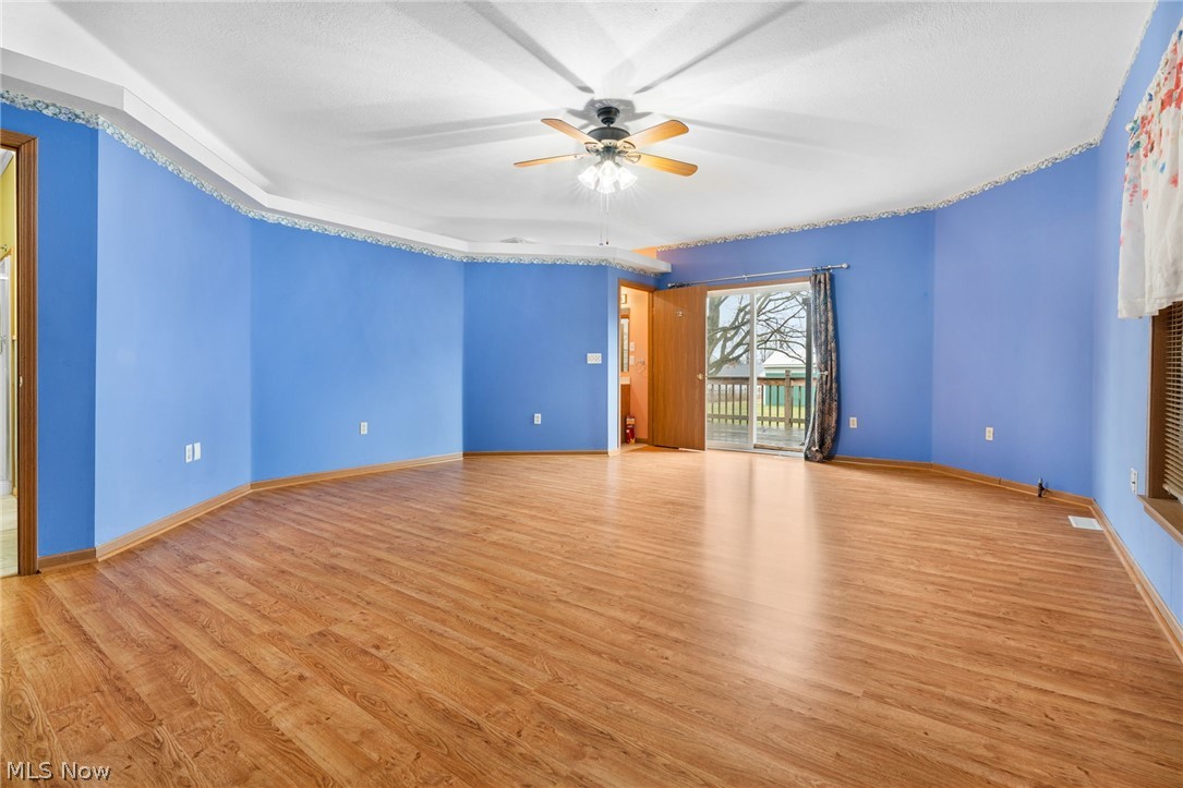 1640 Old Delaware Road Mount Vernon, OH 43050 - Photo 19 of 49 Unfurnished room with light wood-style floors and a ceiling fan