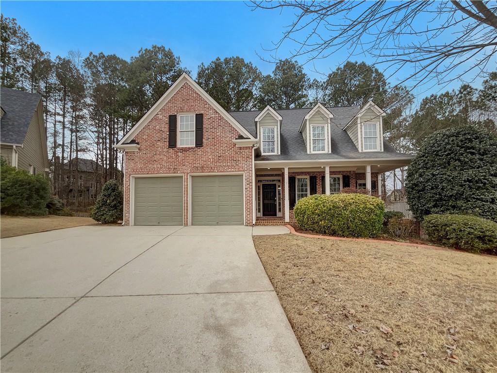 45 Windflower Court Dallas, GA 30132 - Photo 1 of 1 a front view of a house with a yard and garage