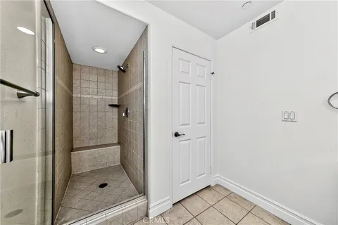 a bathroom with a shower and sink