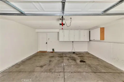 a view of a kitchen with microwave and cabinets