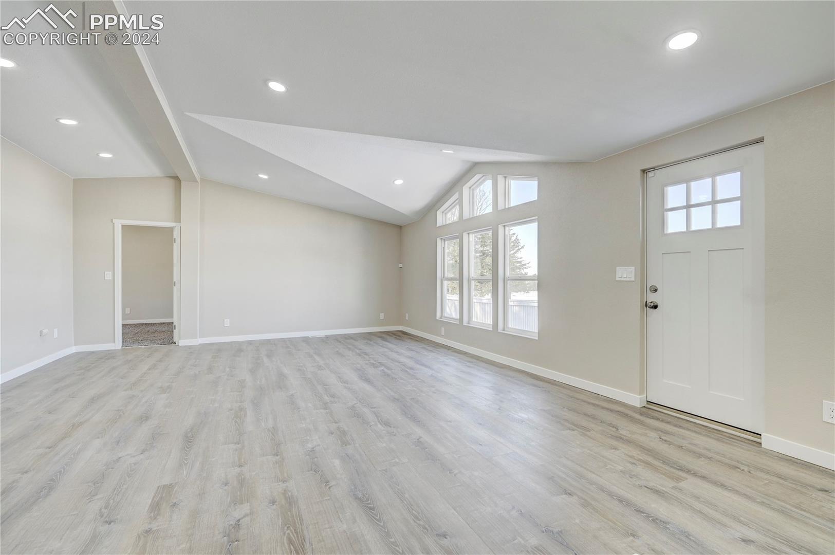 6605 Rio Road Peyton, CO 80831 - Photo 29 of 45 Entryway with lofted ceiling and light hardwood / wood-style flooring