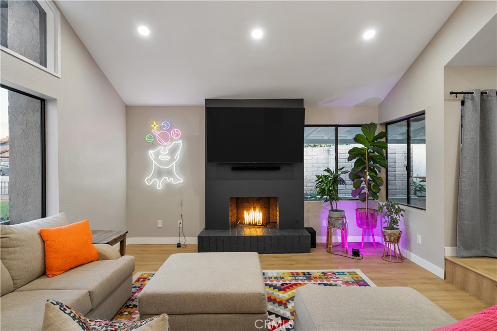 a living room with furniture and a fireplace