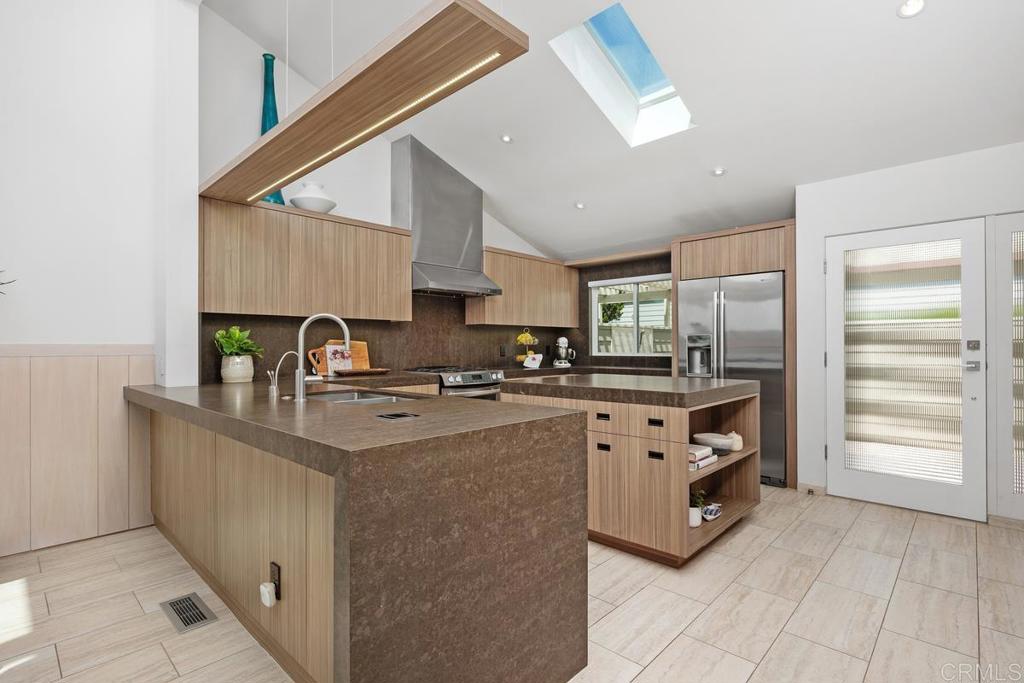 1856 Parliament Road Encinitas, CA 92024 - Photo 11 of 42 a kitchen with stainless steel appliances granite countertop a stove and a sink