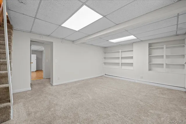 an empty room with shelves