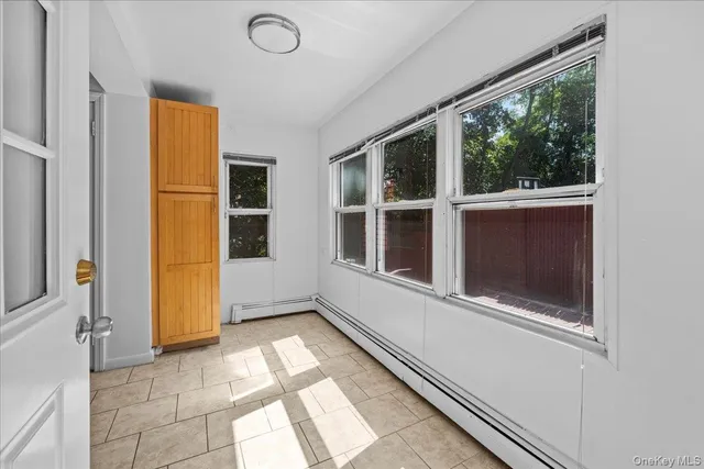 a view of a door and a window