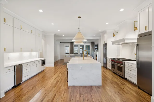 a kitchen with a dining table and chairs