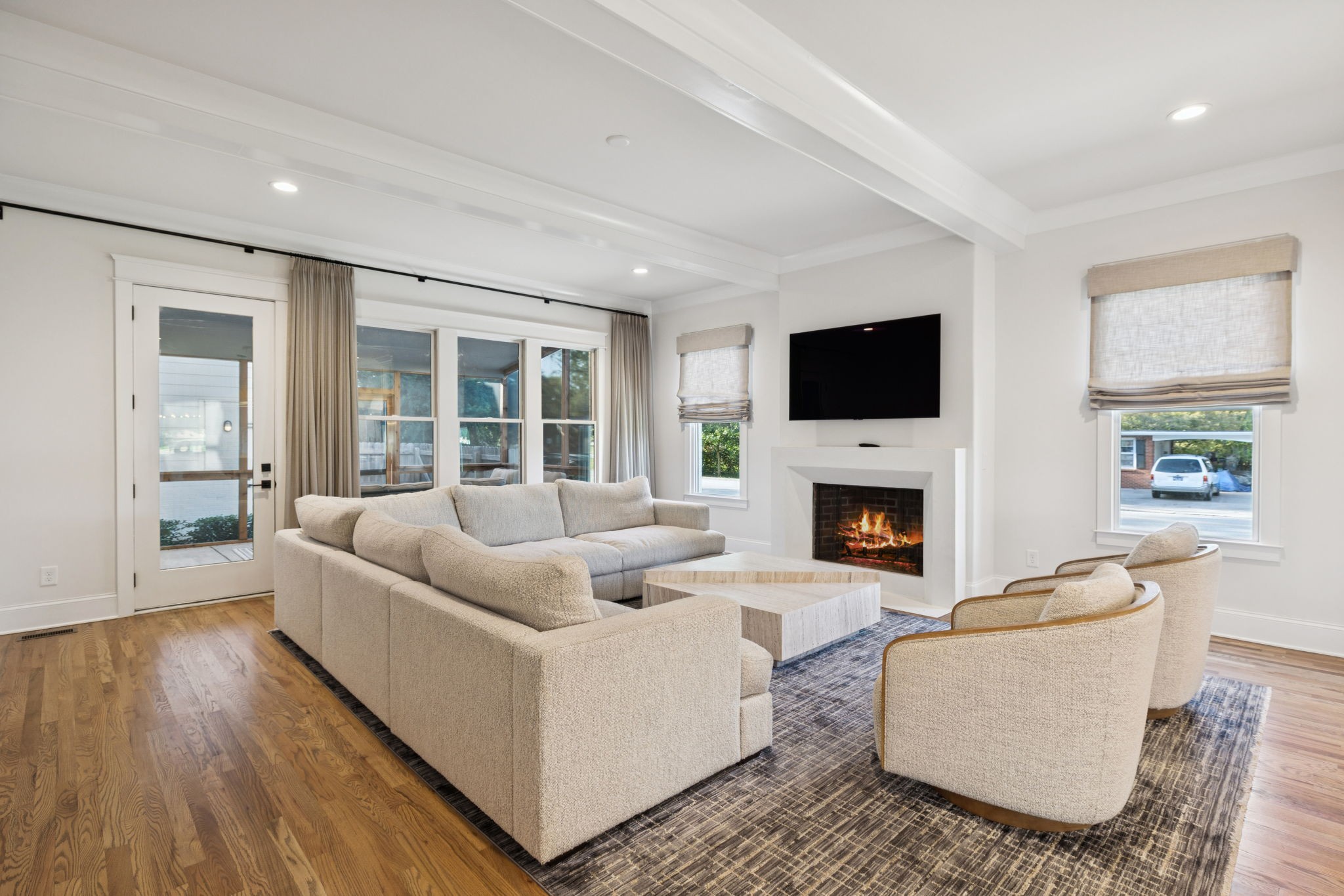 813 Hillsboro Road Franklin, TN 37064 - Photo 25 of 79 a living room with furniture a fireplace and a flat screen tv