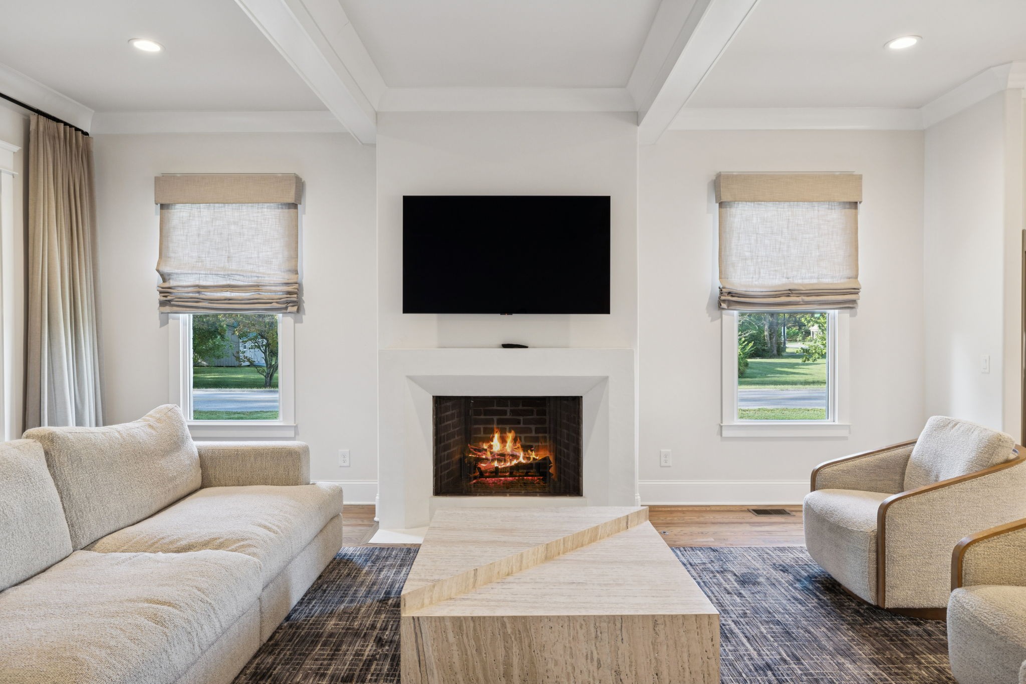 813 Hillsboro Road Franklin, TN 37064 - Photo 26 of 79 a living room with furniture a fireplace and a flat screen tv