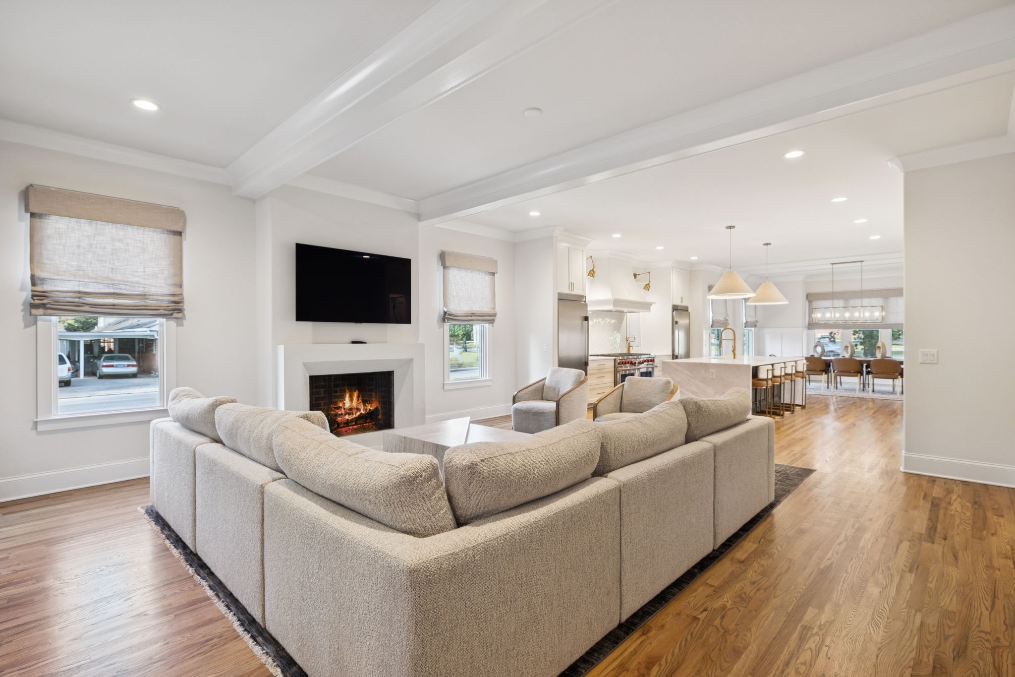 813 Hillsboro Road Franklin, TN 37064 - Photo 27 of 79 a living room with furniture a fireplace and a flat screen tv