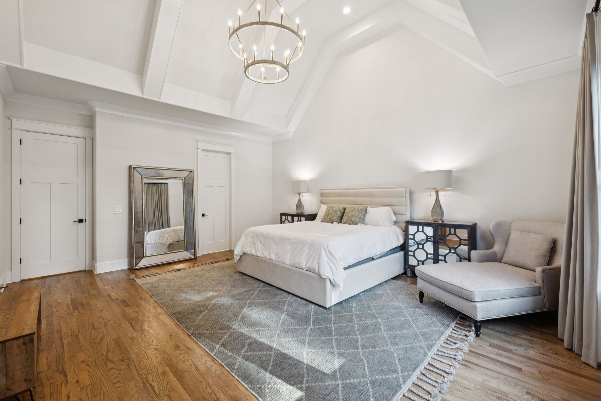 813 Hillsboro Road Franklin, TN 37064 - Photo 30 of 79 a spacious bedroom with a bed a chandelier and a mirror