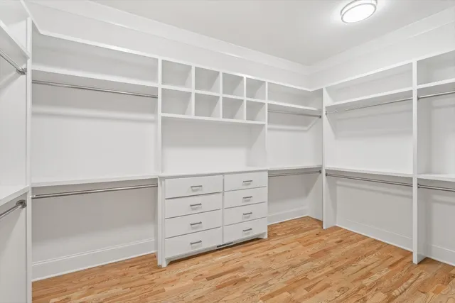 an empty room with a empty space and windows