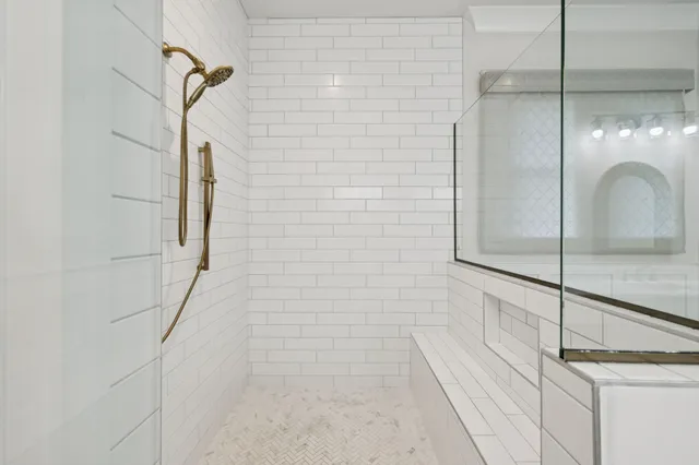 a living room with furniture and large windows