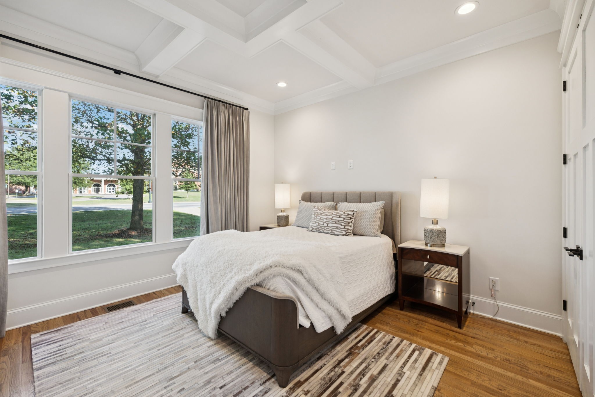 813 Hillsboro Road Franklin, TN 37064 - Photo 43 of 79 a bedroom with a bed and wooden floor