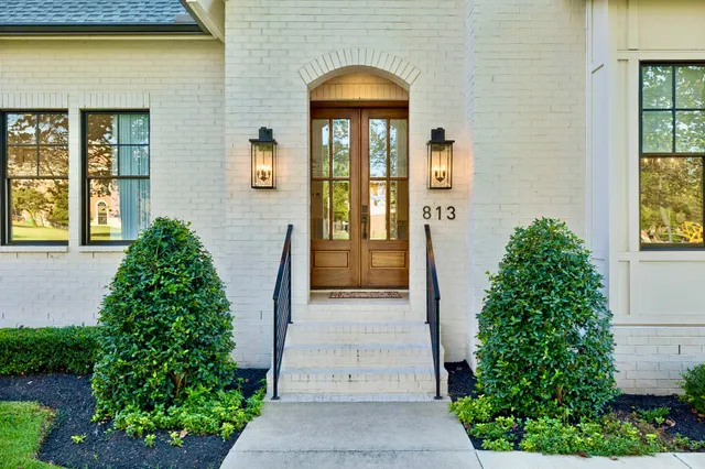 a view of a hallway view with wooden floor and staircase
