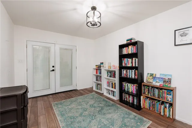 a view of room with window and wooden floor